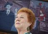 Joyce Gordon stands recently near a mural depicting herself as a 20-year-old dancer at The Carousel club along with club owner Jack Ruby and fellow dancer Tammy True. The mural by artist Isaac Brown is located in the back alley of 2616 Commerce St. in the Deep Ellum area of Dallas.