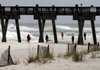 Visitors to Pensacola Beach in Florida watch the waves roll in from Tropical Storm Ida on Monday.