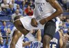 Kentucky’s John Wall lets out a yell after dunking during the first half of an exhibition game against Clarion on Friday night in Lexington, Ky. Wall is part of a recruiting class that has been ranked No. 1 nationally and is expected to help lead the Wildcats back to prominence.