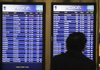 A man checks the arrivals board at Lambert St. Louis International Airport in St. Louis on Oct. 27.