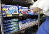 A worker adjusts a display of Kraft Food’s Oreo cookies at a store in Palo Alto, Calif., in this 2008 file photo.