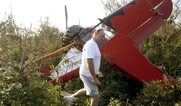 siloam-springs-airport-manager-michael-scroggin-looks-over-a-damaged-plane-tuesday-in-a-field-off-waukesha-road