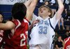Springdale Har-Ber’s Chris Bayles shoots over a Stilwell, Okla., player Tuesday in Springdale.