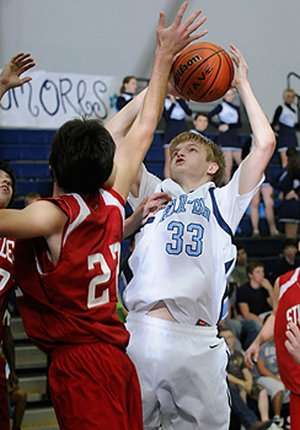 Springdale Har-Ber’s Chris Bayles shoots over a Stilwell, Okla., player Tuesday in Springdale.