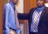 Curtis Vance enters the courtroom with a member of his defense team.
