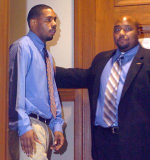 Curtis Vance enters the courtroom with a member of his defense team.