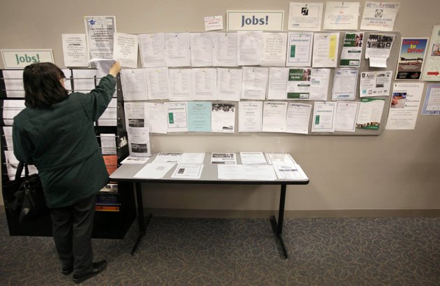 linda-cook-of-cranston-ri-examines-job-listings-at-a-state-managed-employment-center-in-providence-ri-earlier-this-month-cook-who-is-unemployed-worked-in-mortgage-sales-before-being-laid-off