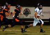 Fayetteville senior Michael Heintzman outruns the Rogers Heritage defense to score a touchdown Friday in Gates Stadium In Rogers.