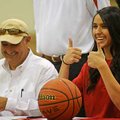 Hanna Qedan of Farmington gives the thumbs-up sign after signing a basketball letter of intent Wedne...