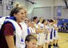 Rogers High senior guard Morgan Hook, left, laughs with her teammates during a multimedia presentation of her basketball career at the school Wednesday at Rogers High. Hook signed a letter of intent to play for the University of Oklahoma.