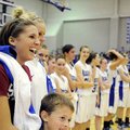Rogers High senior guard Morgan Hook, left, laughs with her teammates during a multimedia presentati...