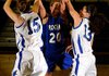 Rogers High sophomore guard Sarah Grace Groves, left, and junior guard Madeline Fusillo block the shot of sophomore Lydia Wilkerson during the first half of their Blue-White scrimmage Wednesday.