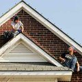 Drew Thompson, left, and Adam Brandes, owner of “At Your Service,” a professional holiday illuminati...