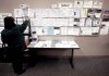 Linda Cook, of Cranston, R.I., examines job listings at an employment center, in Providence, R.I., on Nov. 5. New claims for unemployment insurance fell more than expected last week.