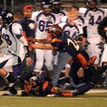 Fayetteville junior quarterback Brandon Allen eludes Rogers Heritage junior linebacker Jason Rehbloc...
