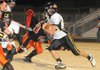 Prairie Grove running back Thomas Soehner, right, runs with the ball during last week’s game against Gravette. Prairie Grove travels to Dumas tonight for a firstround game in the Class 4A state playoffs.