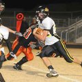 Prairie Grove running back Thomas Soehner, right, runs with the ball during last week’s game against...