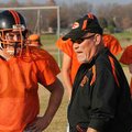 Duke Mobley, Gravette High School assistant football coach, calls in the offensive line for practice...