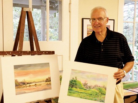 maumelle-artist-david-paul-cook-shows-samples-of-his-latest-project-watercolors-showing-parallels-of-egypt-and-arkansas-the-painting-on-the-left-shows-the-little-rock-skyline-with-the-arkansas-river-in-the-foreground-which-he-said-is-similar-to-the-skyline-of-cairo-on-the-nile-river-the-painting-on-the-right-shows-the-toltec-mounds-near-scott-which-the-artist-compares-to-pyramids-and-monuments-in-egypt