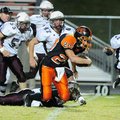 Gravette’s Michael Croasdell 
breaks a tackle during a touchdown run Oct. 9 against Huntsville.