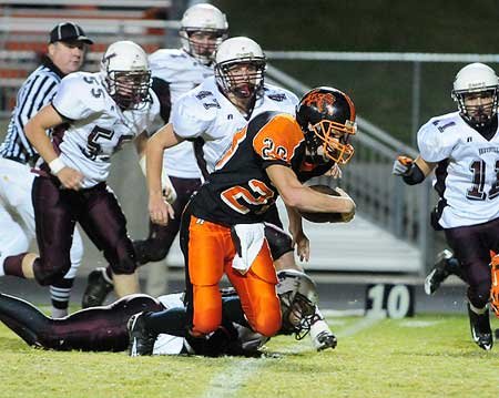 Gravette’s Michael Croasdell breaks a ...
