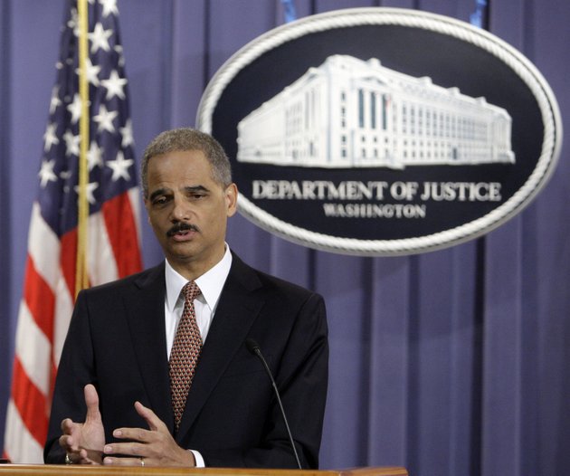 attorney-general-eric-holder-gestures-during-a-news-conference-at-the-justice-department-in-washington