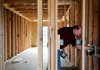 Rick Bramall, chief plans examiner for Springdale, inspects a new home Thursday on Rosemary Avenue in Springdale. The builder could request inspections online, if the city’s Building Department switches software.