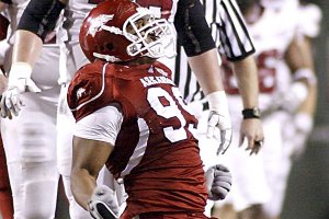 Arkansas defensive tackle Lavunce Askew celebrates after he and Tenarius Wright sacked Troy quarterback Levi Brown in the fourth quarter Saturday night in Fayetteville. It was the only time the Arkansas defense was able to sack Brown.