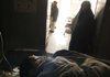 An Afghan mother watches her injured boy Saturday in a hospital in Herat after NATO and Afghan forces moved against insurgents in the Shindand district.