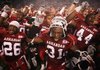 Arkansas' Jerico Nelson (31) and other Razorback players celebrate their win over Troy Saturday, November 14, 2009 in Fayetteville.