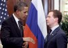 President Barack Obama speaks with Russian President Dmitry Medvedev during their meeting on the sidelines of the Asia-Pacific Economic Cooperation forum in Singapore on Sunday.