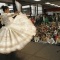 Mirey Medina (left) dances the Marinera, a traditional dance of Peru, for students from Westwood Ele...