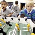 Syrus Thomas (left), 8, and Noah Keeton, 8, both of Bentonville play table soccer Tuesday inside the...