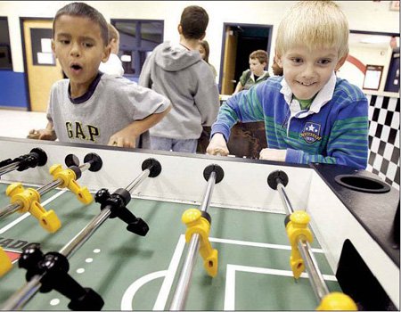 Syrus Thomas (left), 8, and ...