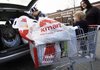 Shoppers leave a Kmart store Thursday in Somerville, Mass. The retailer reports strong sales of toys, home goods and shoes. 