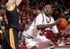 Arkansas’ Marshawn Powell looks toward the basket over the outstretched arms of Appalachian State’s Tyler Webb. Powell led all scorers with 29 points in an 81-72 overtime victory.