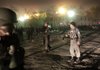 Afghan police and Army soldiers rush to the scene where a rocket hit outside the luxury Serena Hotel in Kabul, Afghanistan, Saturday, Nov. 21, 2009. At least two people were injured, the Afghan Interior Ministry said. 