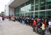 People line up for the free medical clinic outside the Statehouse Convention Center in Little Rock. More than 1,000 doctors and volunteers participated in the event.