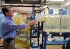 Bill HagenBurger, plant engineer with the Beaver Water District water treatment plant, shows off the pilot plant Thursday at the plant outside Lowell. The pilot plant is designed to function just like the main plant, but on a much smaller scale to allow easier testing of treatment option.