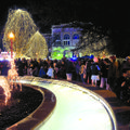 Gabriel Hewett, 2, watches with hundreds of others Saturday as the holiday lights are turned on the ...