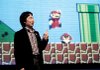 Shigeru Miyamoto, Nintendo Corp.'s top video game designer, gives a keynote address as Mario Brothers plays in the background at a Game Developers Conference in San Francisco in this file photo.
