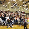 Bentonville fans throw rolls of toilet paper onto the gym floor after the first score by the Tigers ...