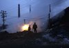 Mine rescue 
Rescue workers stand Sunday near the site of Saturday’s deadly gas explosion at the state-run Xinxing mine in Hegang in China’s Heilongjiang province. Rescuers worked in frigid cold to try to reach miners trapped underground Sunday. 