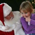 Thinking about her list Dylan Reeves, 3, of Fayetteville ponders her gift choices Sunday while talki...