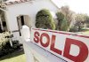 A house outside Los Angeles displays a sold sign. October home sales were up 10.1 percent as a tax credit spurred sales.