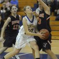 Central’s Caylee Wright drives to the basket as Rogers Heritage’s Ali Johnson defends during Monday’...
