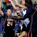 Rogers High’s Wyatt Hively goes up for the shot as Subiaco Academy Keon Walters, right, and Mickell ...