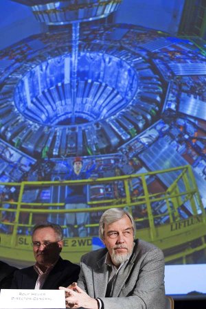 Steve Myers and Rolf Heuer of the European Organization for Nuclear Research talk to reporters about the Large Hadron Collider on Monday in Meyrin, Switzerland.