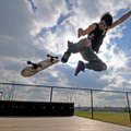 Jordan Abbott skateboards Monday at Luther George Grove Street Park in Springdale. Construction of t...