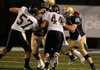 Shiloh Christian senior offensive lineman Josh Salsbury, right, blocks De Queen senior Tyler Reynolds in the first half Friday in Champions Stadium in Springdale. Salsbury is a four-year starter for the Saints.
